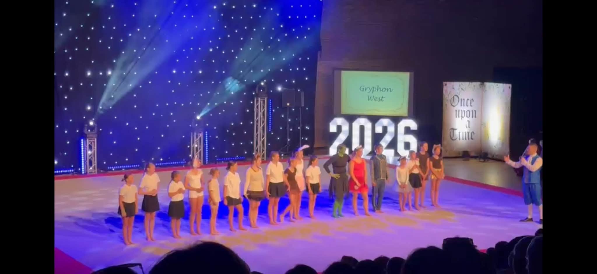 Gryphon West gymnasts performing on stage at London Festival of Gymnastics
